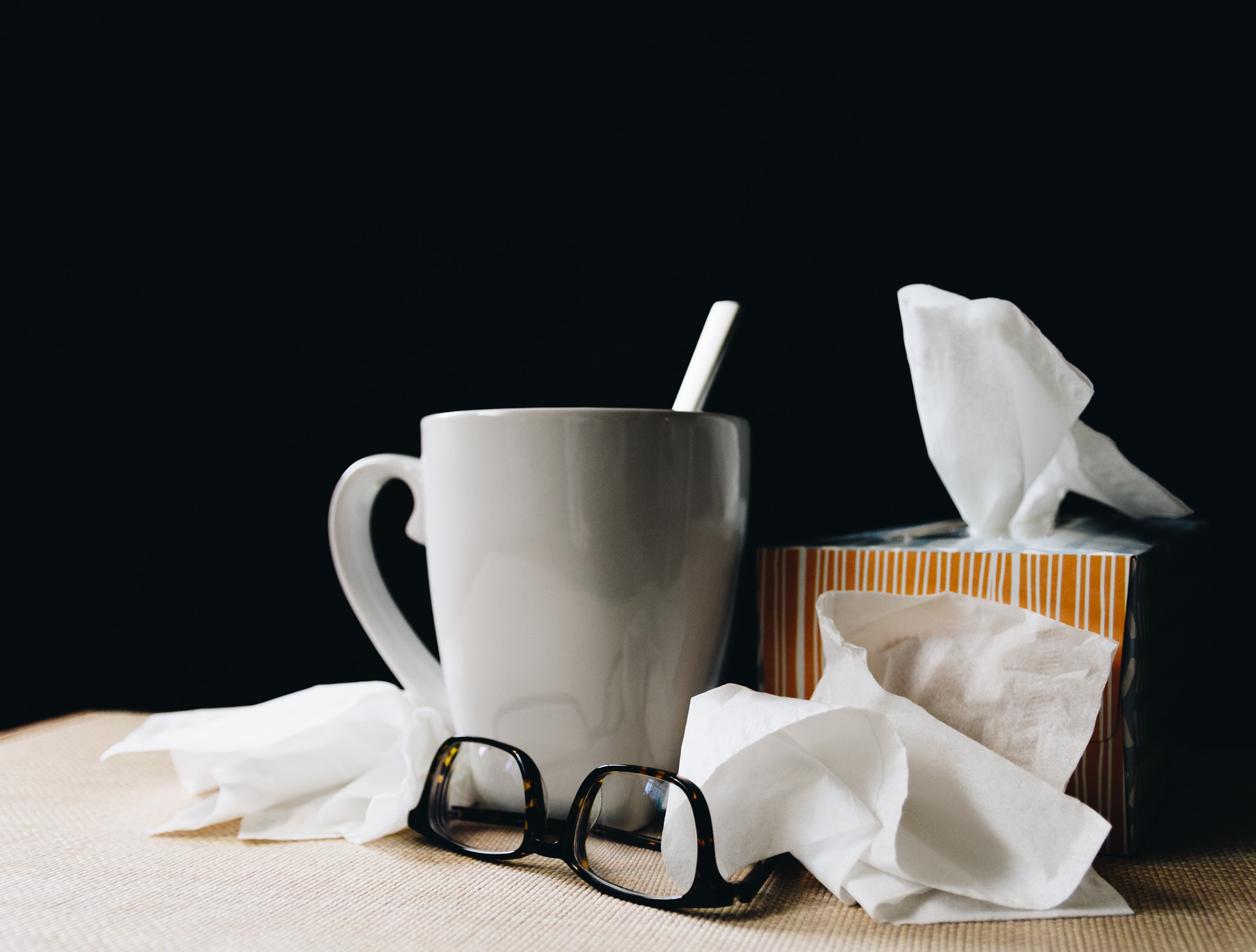 Kleenex, mug, and glasses